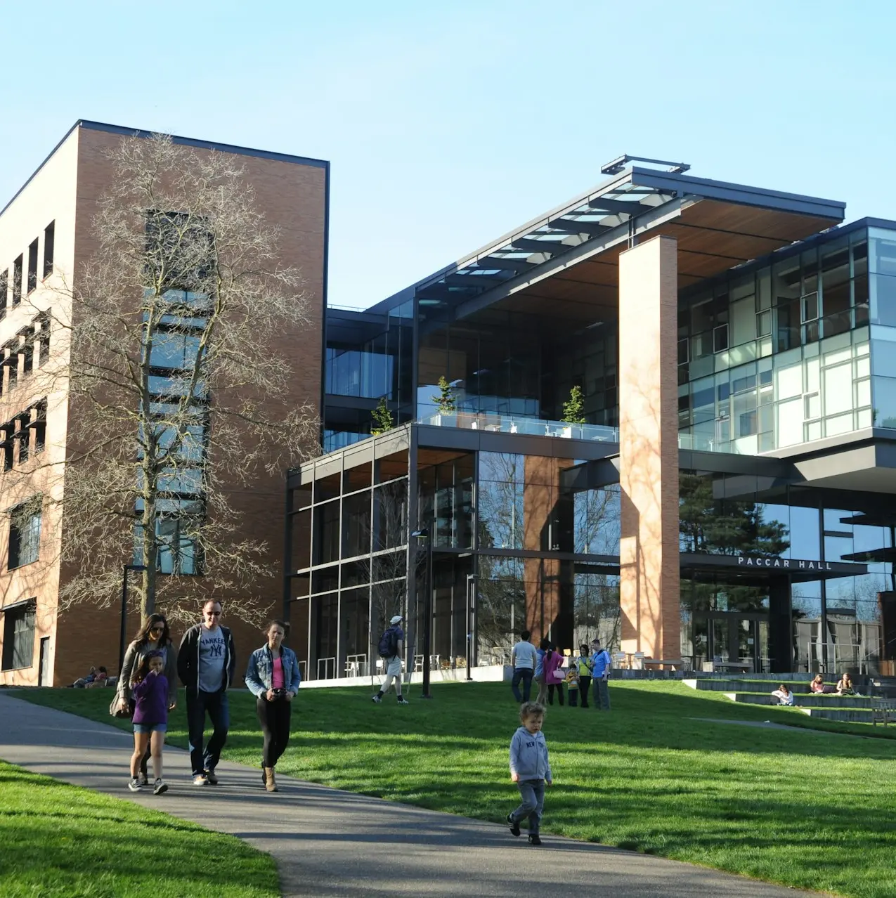 people walking near Paccar Hall University of Washington during daytime